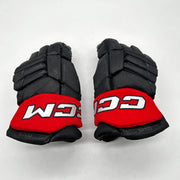 CCM HGJSCHL - Used Pro Stock Hockey Gloves (Black/Red)